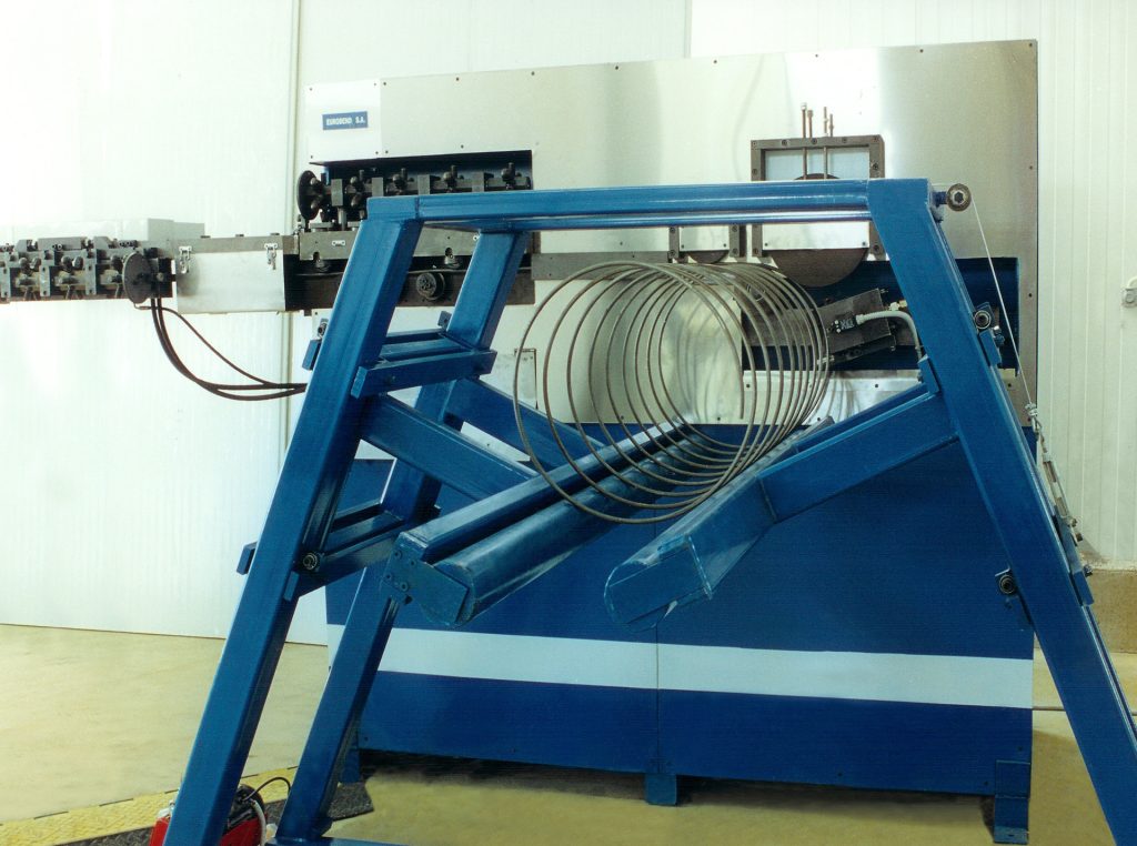 High-volume production of circular ring and spiral reinforcement stirrups from coil